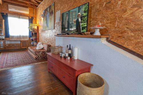 a living room with a table and a wall at Healing Hands in Merom Golan