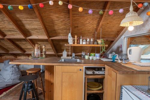 a kitchen with a sink and a counter in a room at Healing Hands in Merom Golan