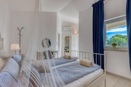 Postel nebo postele na pokoji v ubytování Villa Torre II