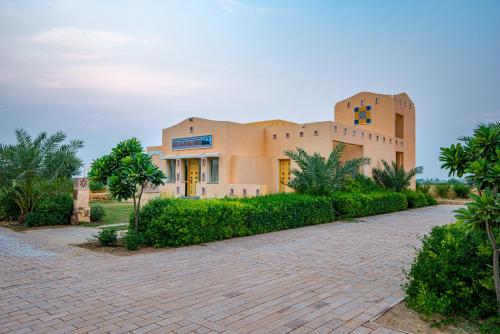 a building with a brick driveway in front of it at Anand Bagh Resort & Spa by Ananta in Sālāsar