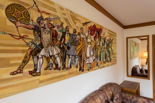 a painting on the wall of a living room at Hotel Lindenhof Hubmersberg in Pommelsbrunn