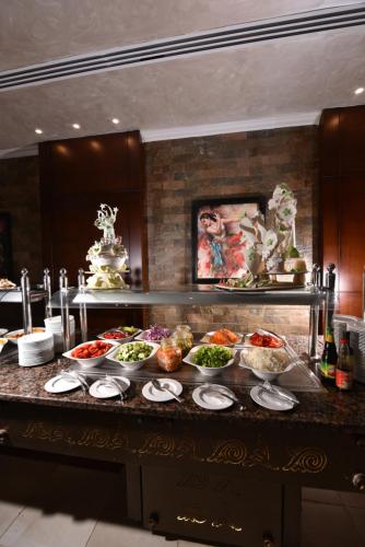 a buffet of food on a counter in a kitchen at Tolip North Coast Hotel in El Alamein