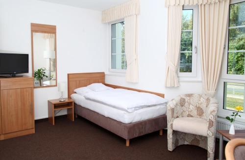 Postel nebo postele na pokoji v ubytování Hotel Fürstenberg