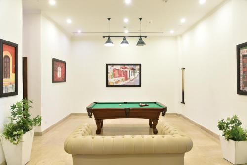 a billiard room with a pool table in it at Tolip North Coast Hotel in El Alamein
