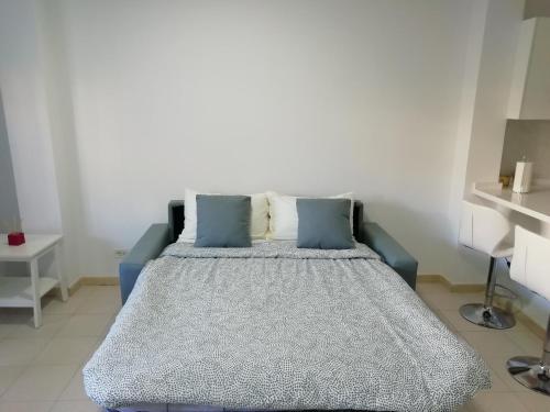 Postel nebo postele na pokoji v ubytování AVENIDA DELUXE CANDELARIA