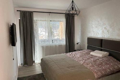 En eller flere senge i et værelse på Casa Skadi, Zamora,Busteni