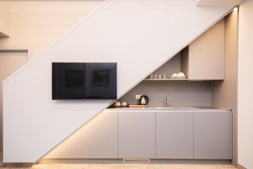 a kitchen with a skylight in the middle of a wall at SPA Nida in Nida