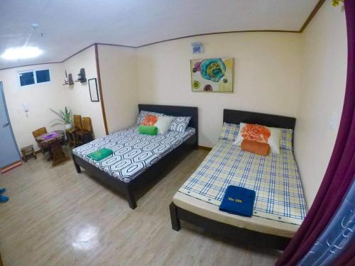 En eller flere senge i et værelse på Zenmist properties - Studio Unit