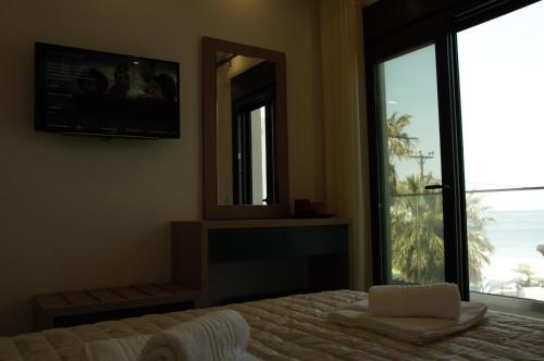 Ένα ή περισσότερα κρεβάτια σε δωμάτιο στο Hotel Medusa