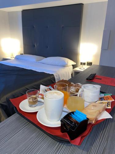 Una cama o camas en una habitación de Victoria Hotel