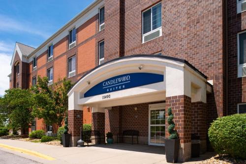 a building with a sign that reads guildford hotel at Candlewood Suites Olathe by IHG in Olathe