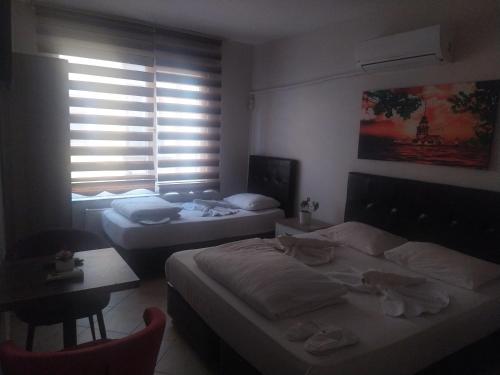 Postel nebo postele na pokoji v ubytování Hotel Kiwi