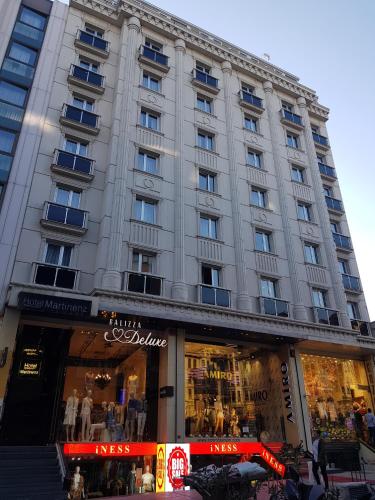 a large building with a store in front of it at Martinenz Hotel Old City in Istanbul
