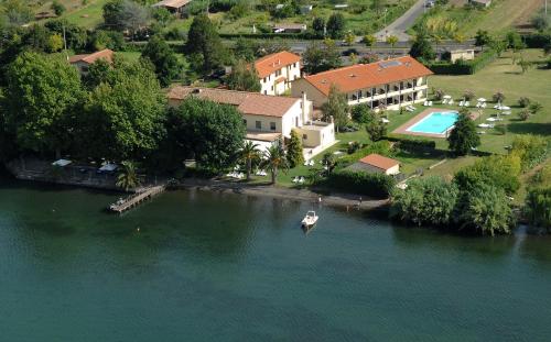 an aerial view of a house on the water at Hotel Eden Sul Lago in Bolsena