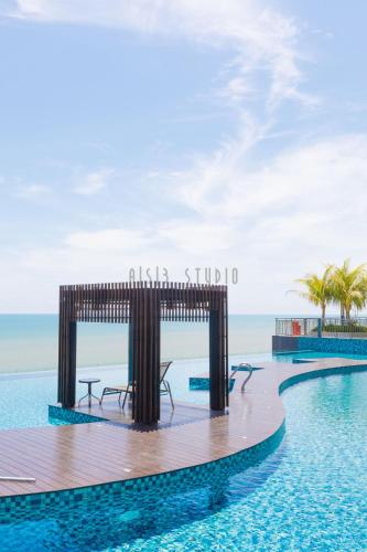 a rendering of a swimming pool with a table in the water at AISI3 Studio Seaview at Tanjung Lumpur in Kuantan