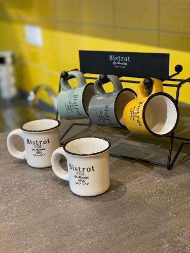 a group of coffee cups sitting on a counter at VANNUCCI 71 APT in Perugia