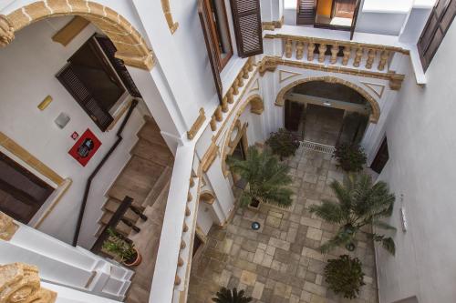 an overhead view of a building with palm trees at Al Pescatore Hotel & Restaurant in Gallipoli