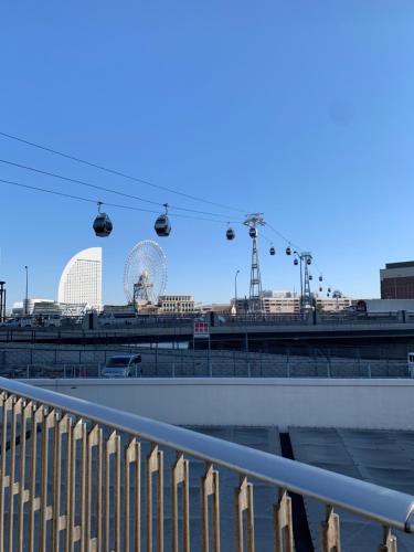 a view of a ferris wheel in a city at YokohamaKannai HouseBar in Yokohama