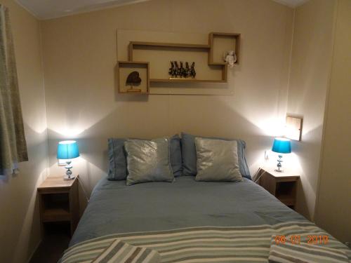 Кровать или кровати в номере Poppy Lodge