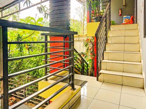 a staircase in a house with colorful stairs at Penginapan Marsya Prima Syariah in Jakarta