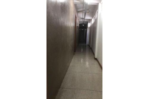 a hallway in an office building with a long corridor at STUDIO 205 | WIFI 600MB | RESIDENCIAL JC, um lugar para ficar. in Belém