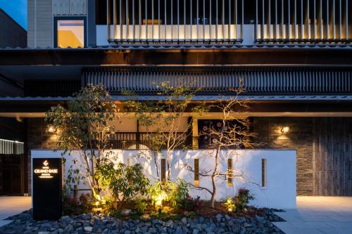 a building with lights in front of it at Chiyokura HOTEL SHUKU Nagoya in Nagoya