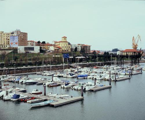a bunch of boats are docked in a harbor at Hotel Las Anclas in El Astillero