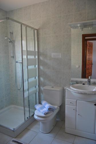 a bathroom with a toilet and a sink and a shower at Rosalalinda - cosy semi-detached home with sea views and large terrace in Moraira