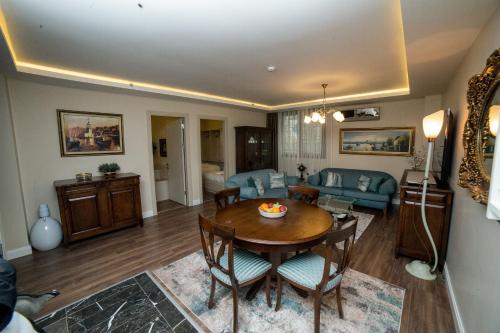 a living room with a table and a couch at The Charm Hotel - Old City in Istanbul