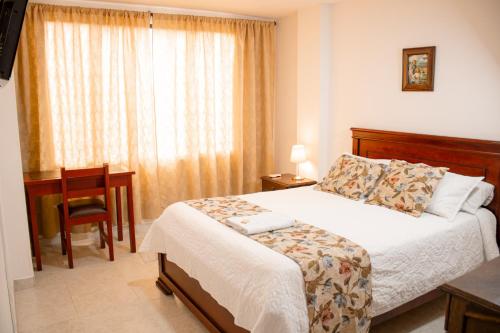Postel nebo postele na pokoji v ubytování HOTEL TORRE REAL