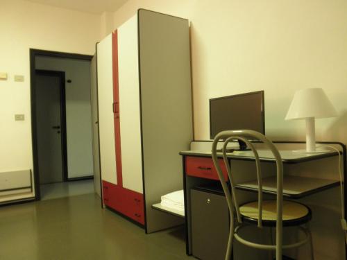 an office with a desk with a chair and a computer at Park Hotel in Castrocaro Terme