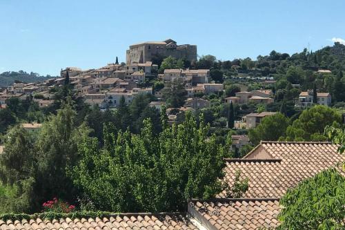 a view of a city with houses on a hill at studio meublé classé 2 étoiles - 30m² in Gréoux-les-Bains