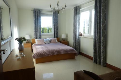 Ένα ή περισσότερα κρεβάτια σε δωμάτιο στο Apartament Perełka