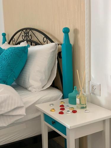 a bed with a table with medicines on it at Via Arad Apartments in Arad