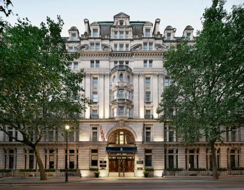 a large white building with an american flag at Club Quarters Hotel Trafalgar Square, London in London