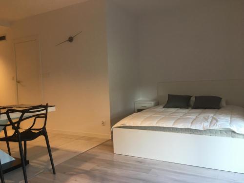 Un pat sau paturi într-o cameră la Apartament Fibra Grande