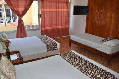 Katil atau katil-katil dalam bilik di Hotel Casa Arena