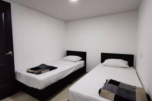Postel nebo postele na pokoji v ubytování Hermoso y cómodo apartamento