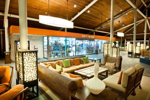 a store with couches and tables in a building at Barceló Bávaro Beach - Adults Only All Inclusive in Punta Cana