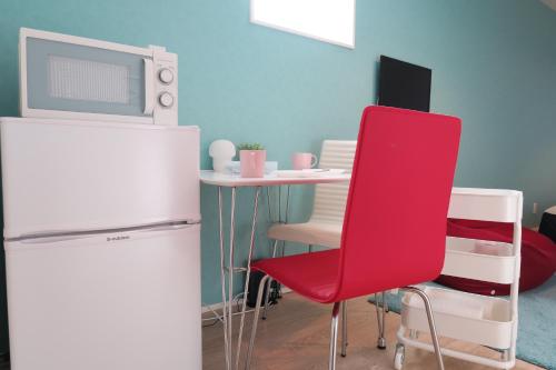 Η κουζίνα ή μικρή κουζίνα στο neko neko apartment