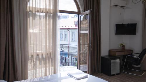 a hotel room with a view of a balcony at Royal Venezia Hotel in Batumi