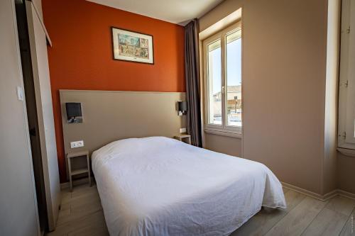 Hotel de la Gare tesisinde bir odada yatak veya yataklar