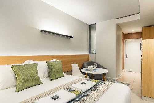 Postel nebo postele na pokoji v ubytování Kozi Suites Nairobi Airport