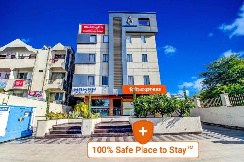 a building with a safe place to stay sign in front of it at FabHotel Naman Palace in Bhopal