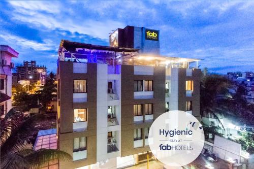 a building with a sign on top of it at FabHotel Imperio - Nr Baner Hill in Pune