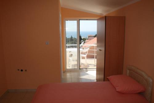 Postel nebo postele na pokoji v ubytování Apartmans Hari