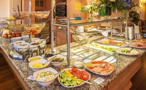 a buffet line with many different types of food at Strandhotel Monbijou GmbH garni in Westerland (Sylt)