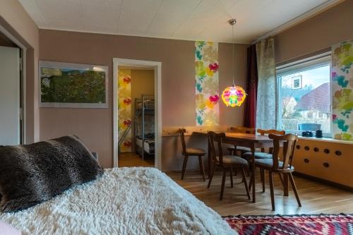 a bedroom with a bed and a table and chairs at Ferienhaus Peggy in Kurort Oybin