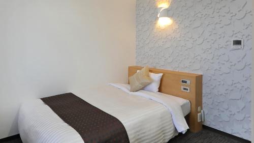 Ένα ή περισσότερα κρεβάτια σε δωμάτιο στο Hotel Annex Inn