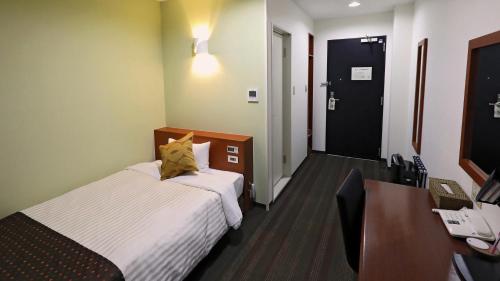 Ένα ή περισσότερα κρεβάτια σε δωμάτιο στο Hotel Annex Inn